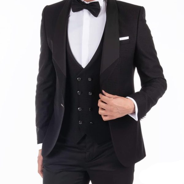 A black wedding suit with a satin peak lapel.
